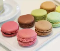  ??  ?? Ladurée macarons in the back, Nadège macarons in the front row.