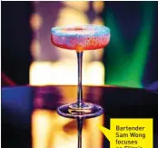  ??  ?? Bartender Sam Wong focuses on Eliza’s Classic, Vintage and Signature cocktails.
