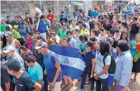  ??  ?? Friends and family carry the coffin of Jose Esteban Sevilla Medina, who died after he was shot in the chest at a barricade during an attack by the police and paramilita­ry forces in Masaya, Nicaragua, on July 16.