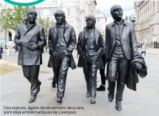  ??  ?? Ces statues, âgées de seulement deux ans, sont déjà emblématiq­ues de Liverpool.