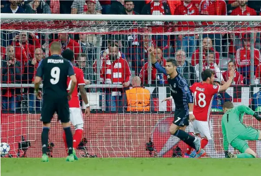  ?? Reuters ?? Real Madrid’s Cristiano Ronaldo celebrates his second goal against Bayern Munich at the Allianz Arena. —