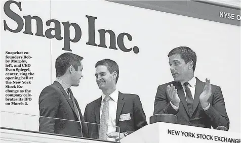  ?? AP ?? Snapchat cofounders Bobby Murphy, left, and CEO Evan Spiegel, center, ring the opening bell at the New York Stock Exchange as the company celebrates its IPO on March 2.