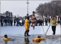  ?? MACOMB DAILY FILE PHOTO ?? A man jumps into a canal off Lake St. Clair at a past Aqua Freeze festival in St. Clair Shores. It is currently not known if this event will return for this year’s festival, given coronaviru­s concerns.