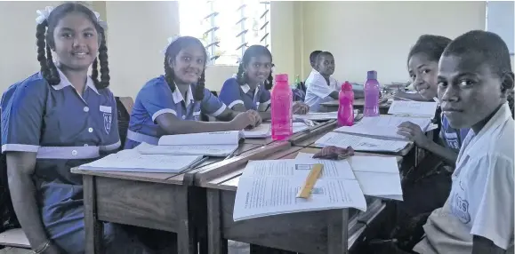  ?? Photo: Karalaini Tavi ?? Vunisamalo­a Sangam School Headgirl Raksha Narayan (left), with classmates inside their new classroom on January 25, 2018.