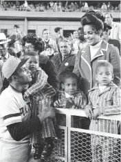  ?? DAN FARRELL New York Daily News file, 1971 ?? Roberto Clemente greets his wife Vera and three sons, from left, Enrico, Roberto Jr. and Luis at Shea Stadium in New York. ‘The name Roberto Clemente is something that fills us with passion and admiration,’ said Marlins pitcher Sandy Alcantara. ‘I think he is a living legend.’
