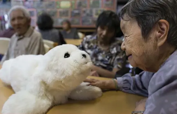  ??  ?? On the market since 2005, Paro — modelled after a baby harp seal — is one of the earliest robots to be used in dementia care.
