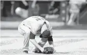  ?? KATHY WILLENS/AP ?? Miami starting pitcher Justin Nicolino reacts after allowing a game-tying, two-run home run in the sixth inning Monday against the Mets. The Marlins loss 4-3; go to
for game story.