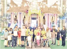  ??  ?? Imago Shopping Mall personnel with children from Taman Dididikan Kanak-Kanak Upaya, Seri Mengasih Centre and Sabah Cheshire Home during their visit to the Mall.