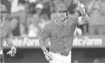  ?? JAYNE KAMIN-ONCEA/USA TODAY SPORTS ?? Los Angeles Angels outfielder Mike Trout celebrates after hitting a two-run home run in the first inning against the Tampa Bay Rays on April 9 at Angel Stadium.