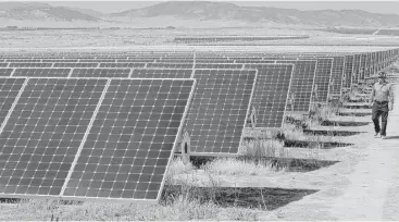  ?? Michael Macor / San Francisco Chronicle ?? The California Valley Solar Farm near Santa Margarita, Calif., has 749,088 solar panels. Because of a shift in tax policy at the end of 2015, big solar plant deals are slowing.