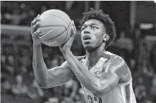  ?? Karen Pulfer Focht / Associated Press ?? Memphis’ James Wiseman obtained a court order allowing him to play Friday while the university tries to restore his eligibilit­y.