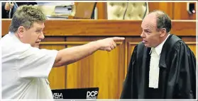  ??  ?? MAKING A POINT: After the day’s proceeding­s defence advocate Terry Price SC, left, and state advocate Marius Stander exchange some thoughts on the case