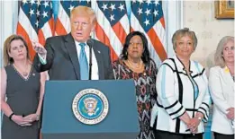  ?? ANNA MONEYMAKER/THE NEW YORK TIMES ?? President Donald Trump marks the centennial of the ratificati­on of the 19th Amendment, which granted women the right to vote, at a ceremony Tuesday in the White House.