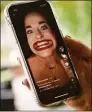  ?? Tyler Sizemore / Hearst CT Media ?? TikTok star Samantha Ramsdell plays her most viewed TikTok video on her phone at her home in Stamford in October 2020.