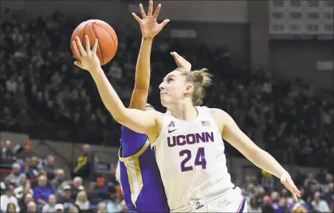  ?? Stephen Dunn / Associated Press ?? UConn’s Anna Makurat shoots during the first half against Tulsa on Sunday. Makurat scored a career-high 21 points in No. 4 UConn’s 92-34 win over Tulsa