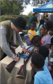  ?? L.A. PARKER - THE TRENTONIAN ?? The Old Barracks Museum presentati­on attracted grand interest during Trenton River Days Fair.