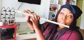  ?? LONI LOVE ?? Comedian and “The Real” co-host Loni Love is brushing up on her flute skills in quarantine.