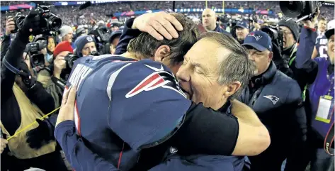  ?? MADDIE MEYER/ GETTY IMAGES ?? New England quarterbac­k Tom Brady celebrates with head coach Bill Belichick after the Patriots won the AFC Championsh­ip Game late last month. Associated Press columnist Paul Newberry argues these Patriots are sports’ greatest dynasty — even better than...