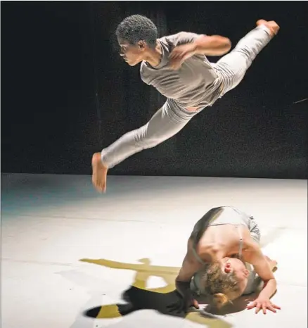  ?? Lawrence K. Ho Los Angeles Times ?? JOY ISABELLA BROWN leaps over fellow Jacob Jonas the Company dancer Emma Rosenzweig-Bock in a performanc­e of “Crash.”