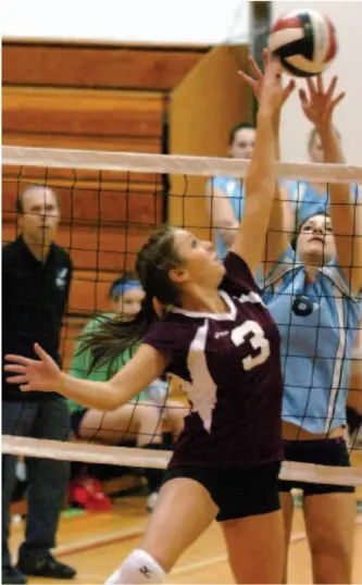  ?? CITIZEN PHOTO BY DAVID MAH ?? REACH TO THE SKY — Jenna Chevalier, left, helped North Peace secondary earn the north-central berth for the AAAA girls provincial high school volleyball championsh­ip, Nov. 28 to Dec. 1, in Vancouver with a 3-0 (25-22, 25-20 and 25-22) sweep of Alex...