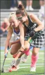  ?? Dave Stewart / Hearst Connecticu­t Media ?? Guilford’s Olivia McDonald, right, and Darien’s Kaci Benoit battle for the ball on Saturday.