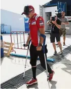  ?? — AFP ?? Another setback: Jorge Lorenzo walks around on crutches in the paddock area at Buriram Internatio­nal Circuit on Thursday. Yesterday, he fell during practice and was taken to the hospital.