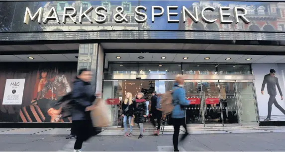  ?? Jonathan Brady ?? > Marks & Spencer has reported a 63.5% plunge in annual pre-tax profits to £176.4m