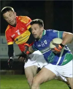  ??  ?? Robert Dempsey (Glynn-Barntown) is tackled by David Larkin.