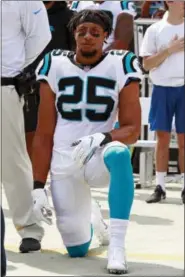  ?? JASON E. MICZEK — THE ASSOCIATED PRESS ?? Carolina Panthers’ Eric Reid (25) kneels during the national anthem before an NFL football game against the New York Giants in Charlotte, N.C., Sunday.