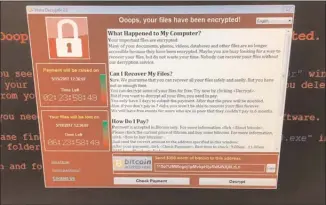  ?? The Associated Press ?? This image provided by the Twitter page of @fendifille shows a computer at a hospital in England. An unpreceden­ted cyberattac­k has already hit tens of thousands of victims in 150 countries and could wreak even more havoc as more malicious variations...