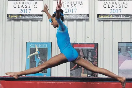  ?? CLIFFORD SKARSTEDT EXAMINER ?? Level 3 gymnast Auviyaa Kirubahara­n, trains on the beam on Friday at Champions Gymnastics in Peterborou­gh.