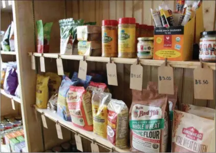  ?? PHOTOS BY MICHILEA PATTERSON — FOR DIGITAL FIRST MEDIA ?? A variety of plant-based food products are displayed on a shelf at the Firefly Café Outpost, an all-vegan grocery store in Boyertown.