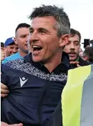  ?? ?? Joey Barton is all smiles after his side’s amazing promotion