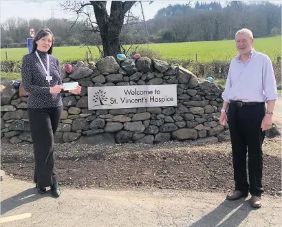  ??  ?? Donation
Rotary president Gordon Drummond handing over the cheque to Donna McConnachi­e of St Vincent’s Hospice