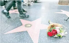  ??  ?? Fans leave tributes on Marshall’s star on the Hollywood Walk of Fame shortly after the news that the actress died, in Hollywood, California, on Tuesday. — AFP photo