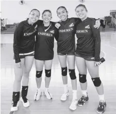  ?? ?? Negrenses Erika Deloria, Shane Carmona, Rhean Almendrale­jo, and Aurea Alvero have won their second NAASCU women’s volleyball championsh­ip with Enderun College Lady Titans.