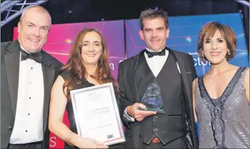  ??  ?? Dylan Mansfield of award sponsor Whitecroft Lighting with winners Fiona and Kenneth Ferguson and also Shereen Nanjiani, who hosted the awards event.