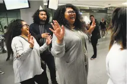  ??  ?? Sokhum Loeun dances before being reunited with her brother, Sok Loeun, at the SFO Internatio­nal Terminal on Wednesday.