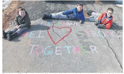  ?? CONTRIBUTE­D ?? Wyatt, Logan and Ethan Bernard spent part of their weekend drawing inspiratio­nal messaging on their driveway for their whole neighbourh­ood to see. Several families on Wilfred Street in Miscouche did the same.