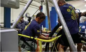  ?? Photograph: Bleu Jackson/AP ?? Divers inspect a water well near Pearl Harbor, Hawaii, in December.