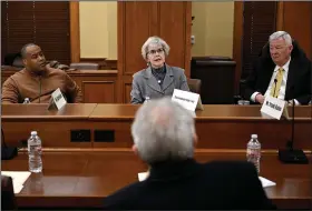  ?? (Arkansas Democrat-Gazette/Stephen Swofford) ?? Clark Smith (from left), Annabelle Imber Tuck, and Tommy May discuss salary adjustment­s for elected officials during a meeting of the Independen­t Citizens Commission at the state Capitol in Little Rock on Friday.