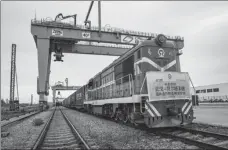  ?? XIAO YIJIU / XINHUA ?? Left: A freight train carrying medical supplies to combat the novel coronaviru­s leaves Wuhan, Hubei province, for Belgrade, Serbia, on May 9.