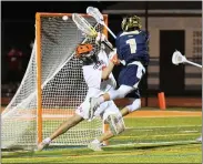  ?? AUSTIN HERTZOG - MEDIANEWS GROUP ?? Spring-Ford’s Chris Quigley (1) takes a leaping shot past Perk Valley goalie Jacob Klosinski. The goal was disallowed due to a crease violation.
