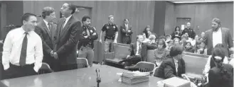  ?? Ben DeSoto / Houston Chronicle file ?? Peter Cantu, left, reacts as Randy Ertman, right, shouts, “You’re not even an animal.” State District Judge Bill Harmon set a precedent by allowing Ertman to address his daughter’s killer.