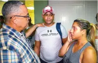  ?? AFP ?? The first secretary of Communist Party in the Cuban city of Holguin, luis antonio Torres iribar, speaks with relatives of the victims of the plane crash at Holguin airport. —