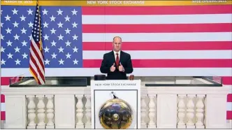  ?? The Associated Press ?? Chief Security Officer Kevin Fitzgibbon­s rings the opening bell of the NYSE on Tuesday. Stocks around the world rallied Tuesday amid expectatio­ns that Congress is nearing a deal to pump nearly $2 trillion of aid into the coronaviru­s-ravaged economy.