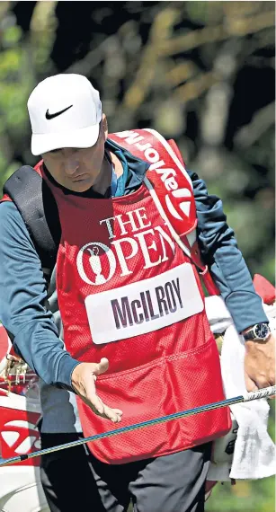  ??  ?? Straight talking: Caddie JP Fitzgerald with Rory Mcilroy yesterday
