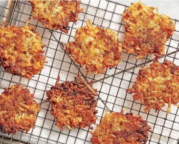 ?? [PHOTO BY TOM MCCORKLE, FOR THE WASHINGTON POST] ?? Hash Brown Latkes With Caramelize­d Onion