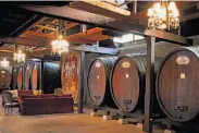  ?? Photos by John Storey / Special to The Chronicle ?? Top: A stained-glass window captures visitors’ attention inside Inglenook Winery. Above: The cask room, where wines are stored and aged.