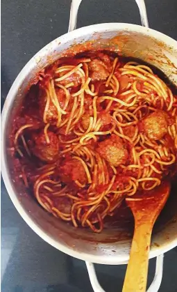  ??  ?? You can opt to toss the spaghetti in the sauce before serving or sim ladle the sauce and meatballs on the cooked spaghetti when servin